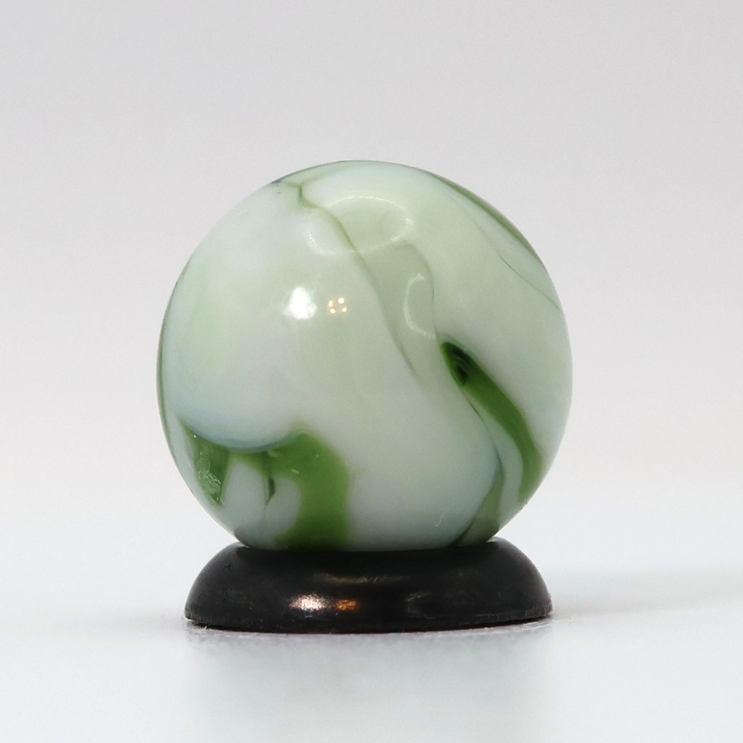 9/16" Swirl Marble White Base with Translucent Green Ribbons NM-