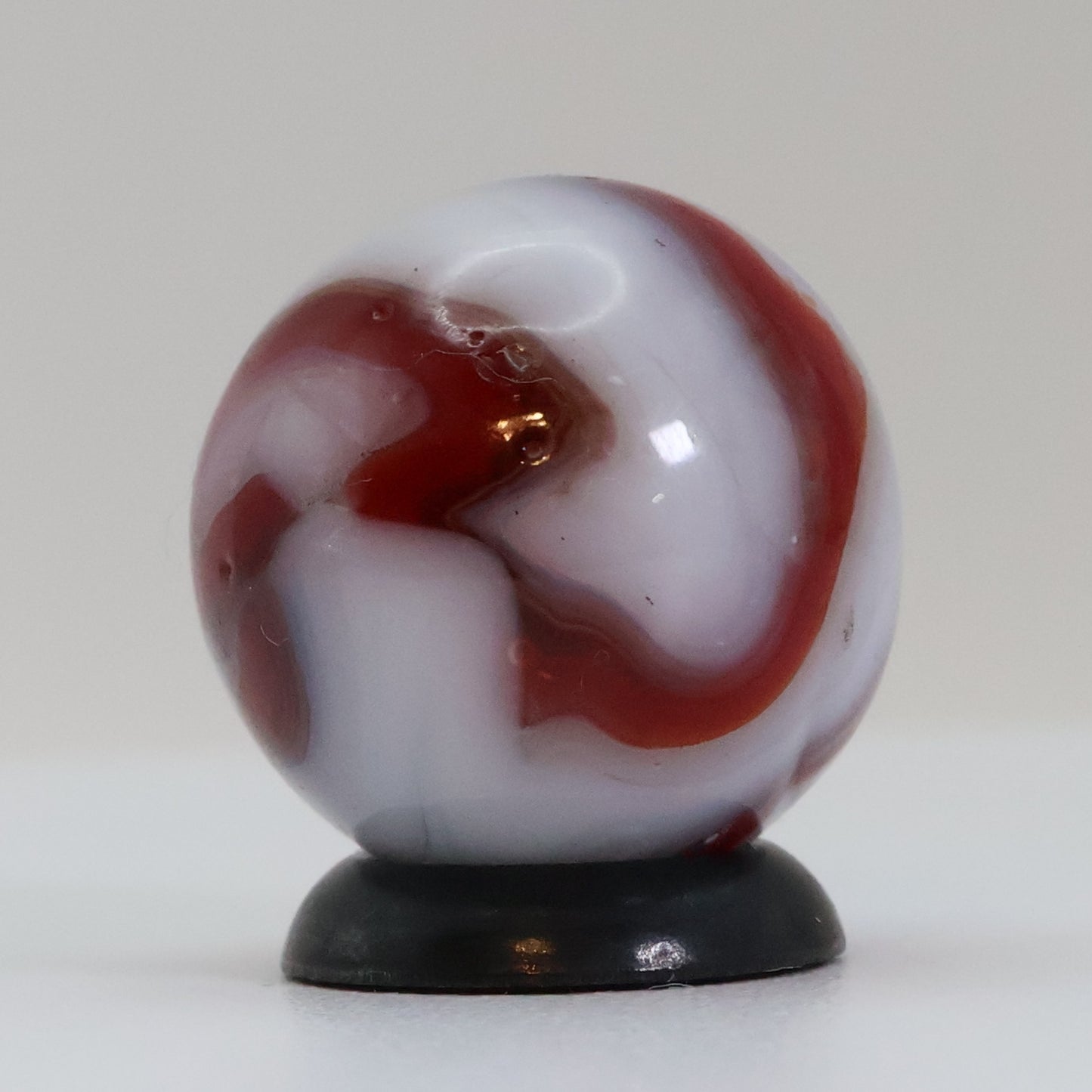 5/8" Swirl Marble Red Calligraphy on White Base NM