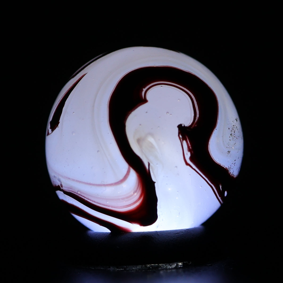 ⅝” Akro Agate Silver Oxblood NM (small pin pricks and one bigger hit)