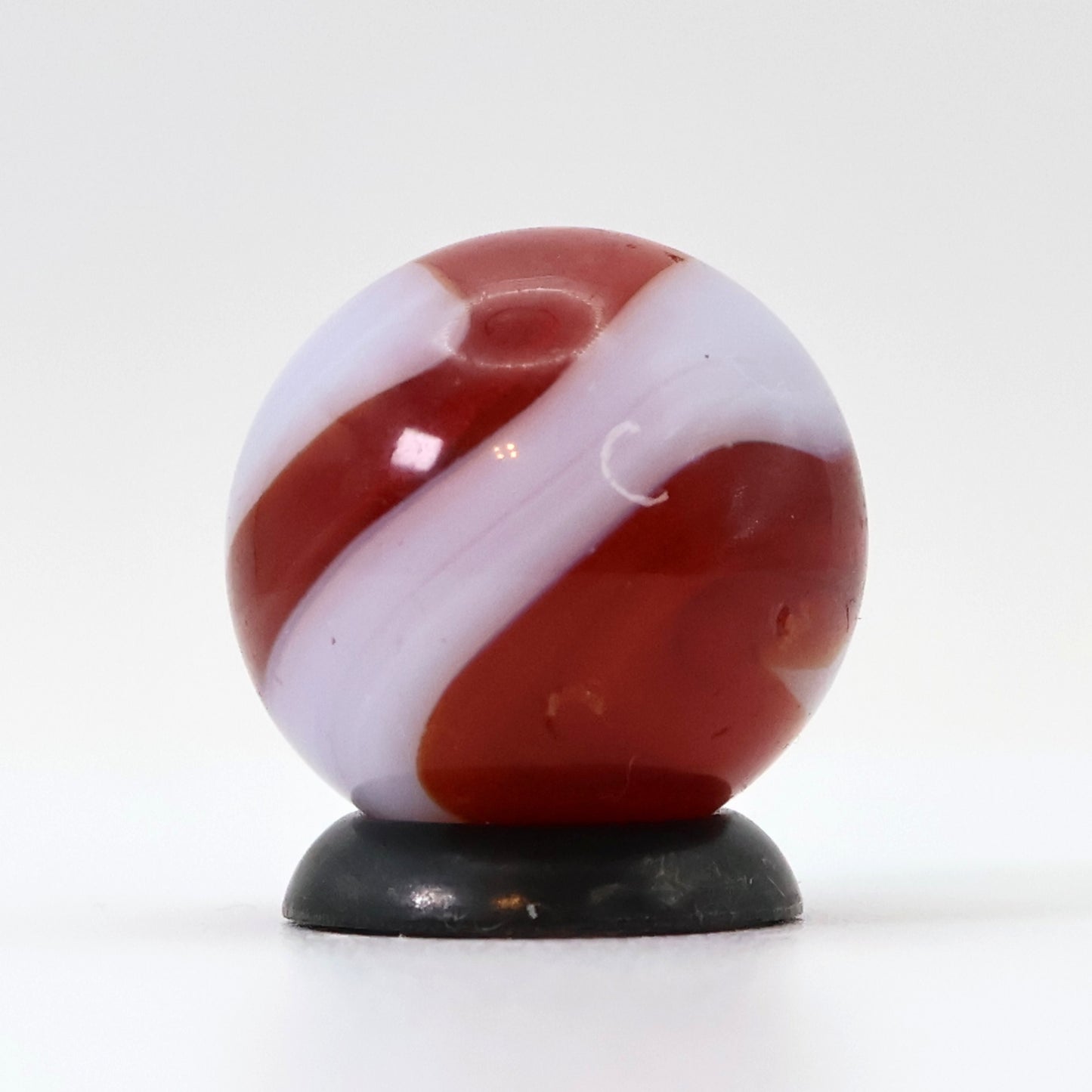 5/8" Akro Agate Corkscrew marble white base, translucent red stripe NM-