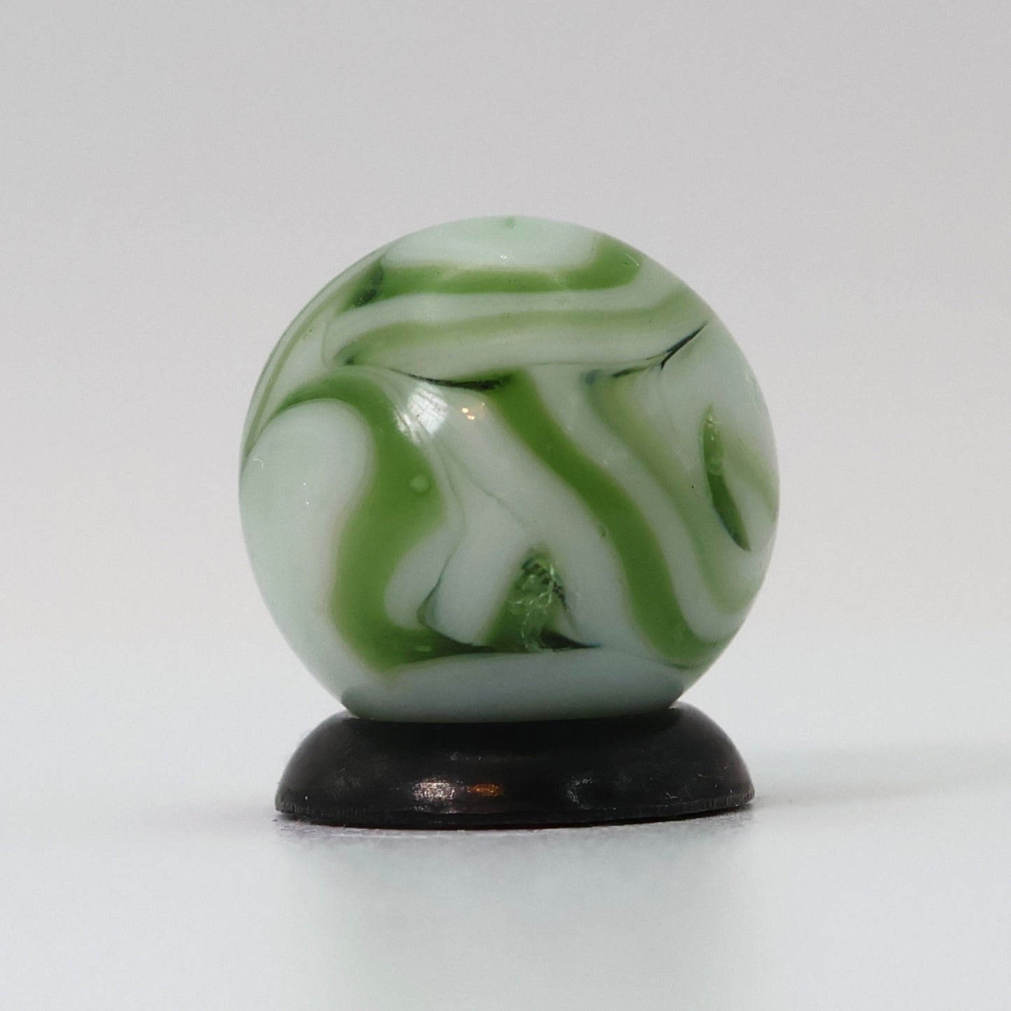 9/16" Swirl Marble White Base with Translucent Green Ribbons NM-