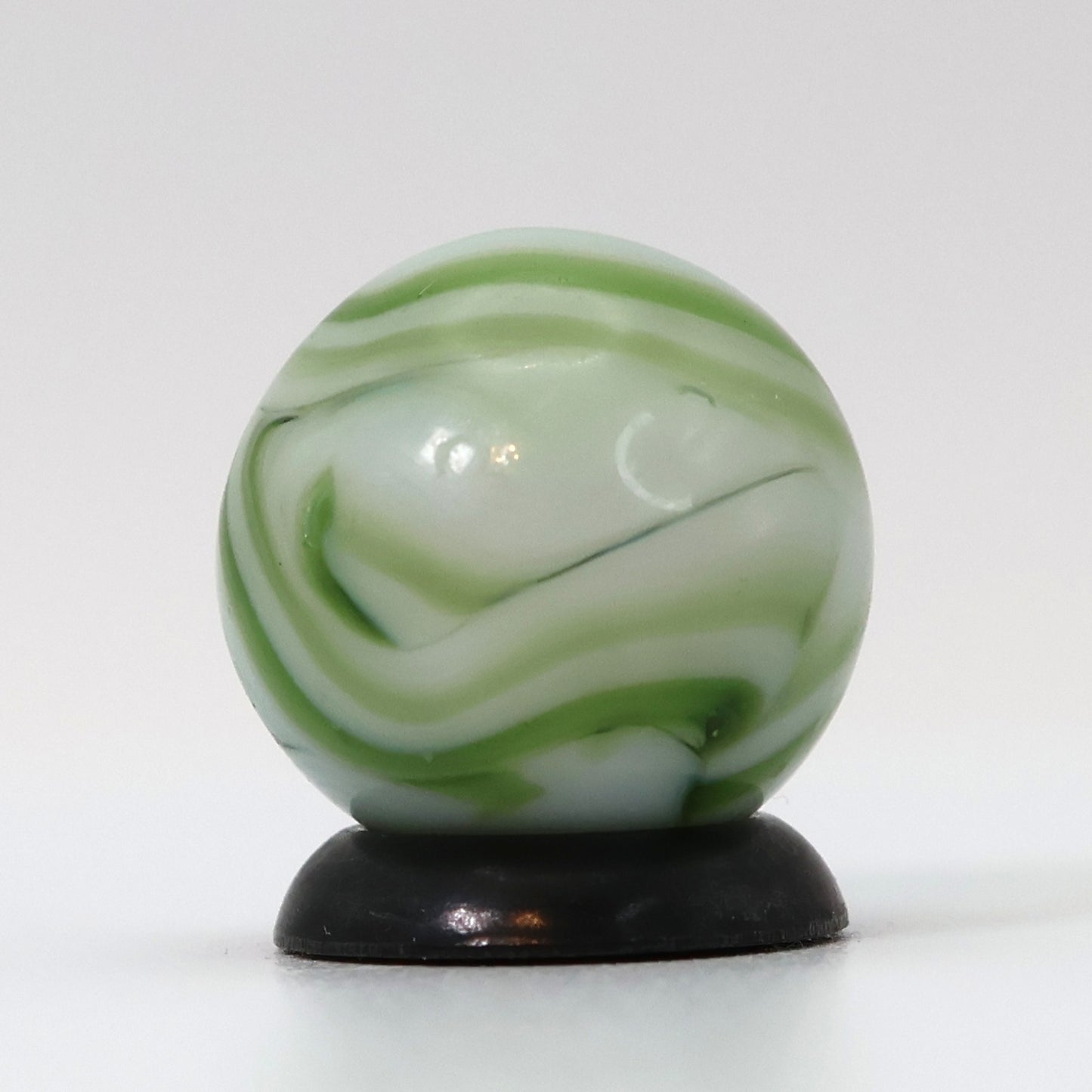 9/16" Swirl Marble White Base with Translucent Green Ribbons NM-