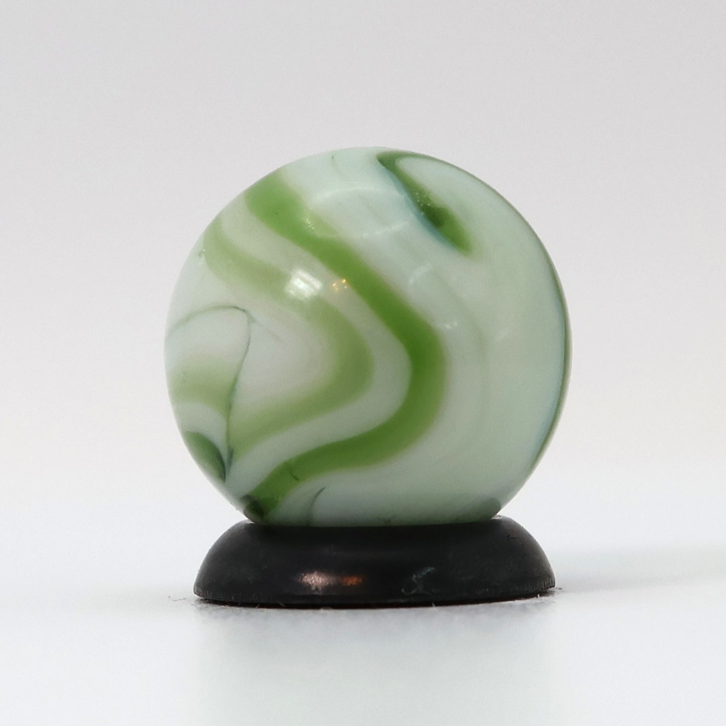 9/16" Swirl Marble White Base with Translucent Green Ribbons NM-