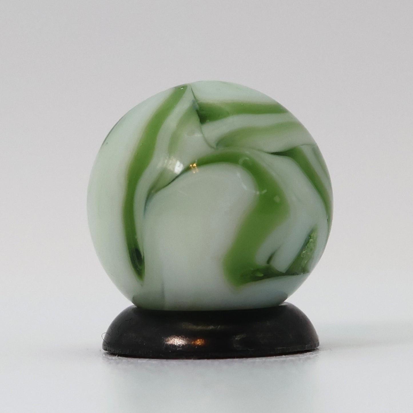 9/16" Swirl Marble White Base with Translucent Green Ribbons NM-