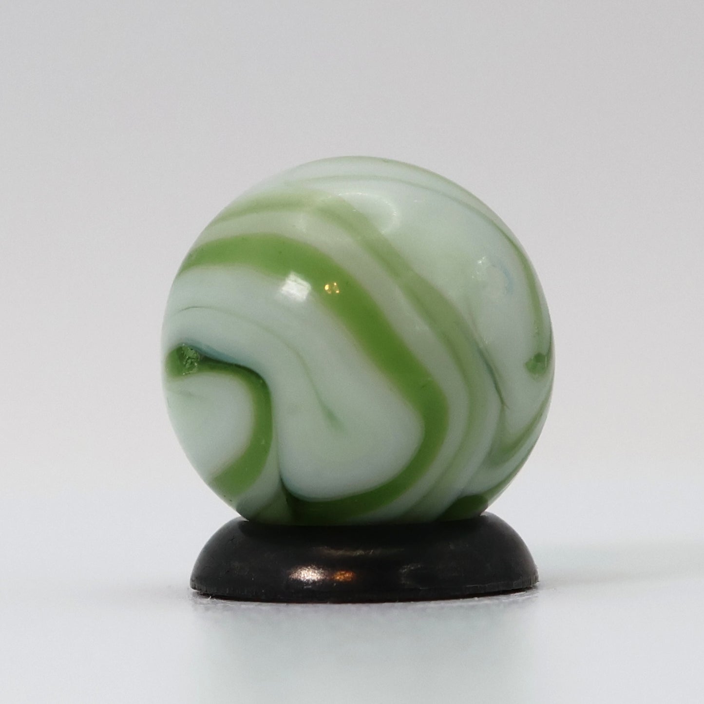 9/16" Swirl Marble White Base with Translucent Green Ribbons NM-