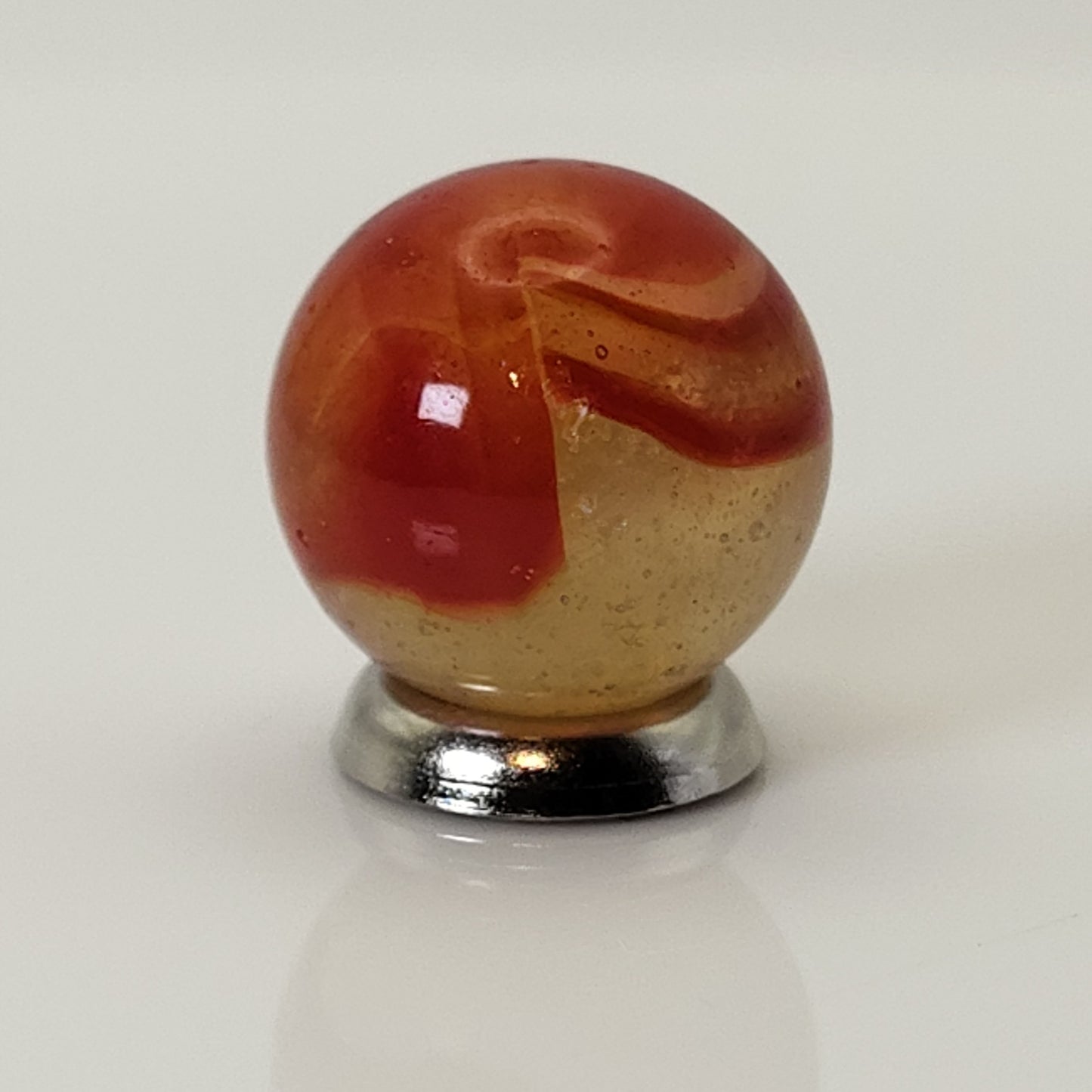 5/8" Peltier Rainbo Marble orange ribbons on Translucent Yellow UV NM