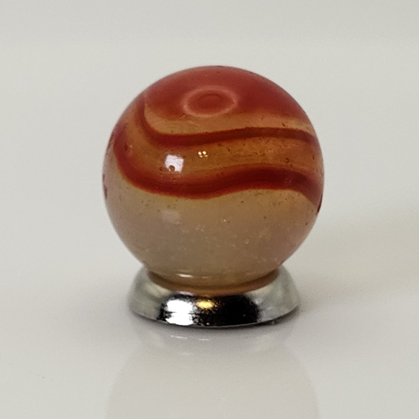 5/8" Peltier Rainbo Marble orange ribbons on Translucent Yellow UV NM