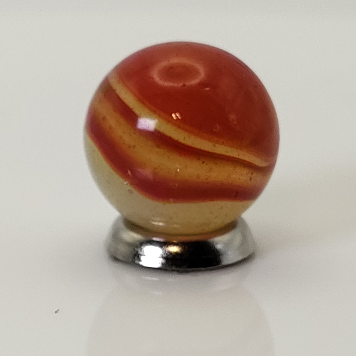 5/8" Peltier Rainbo Marble orange ribbons on Translucent Yellow UV NM
