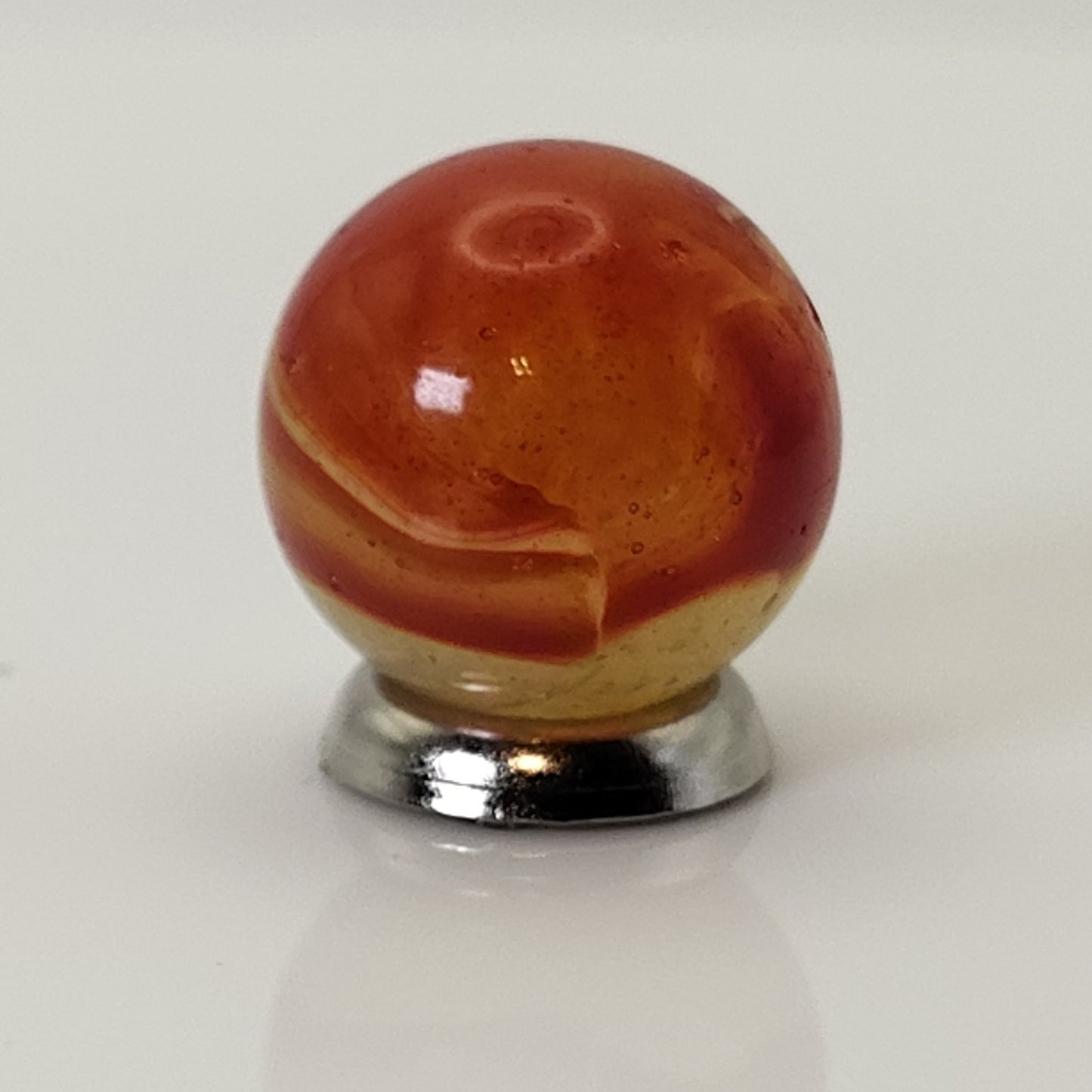 5/8" Peltier Rainbo Marble orange ribbons on Translucent Yellow UV NM