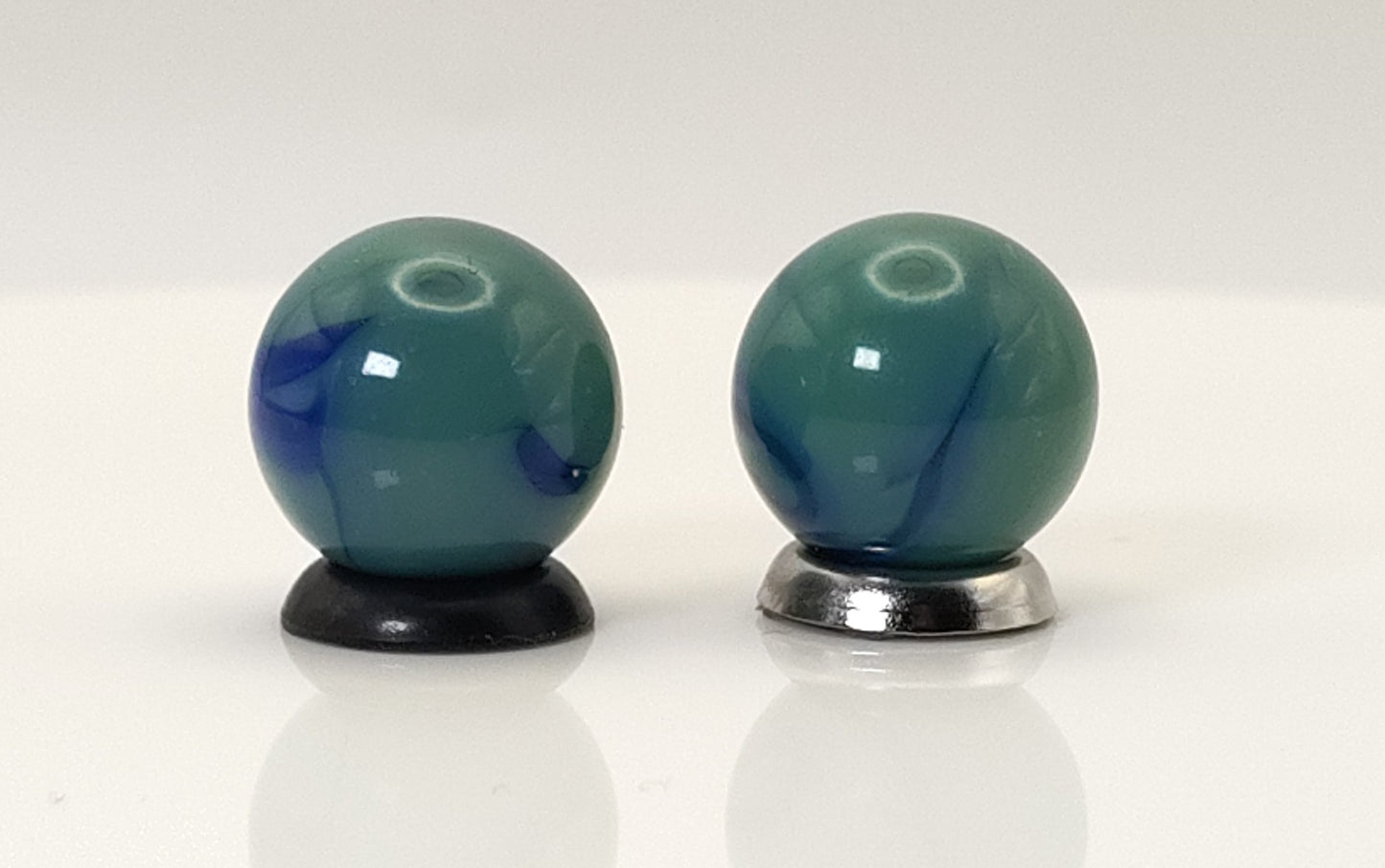 5/8" 2pk green/ blue swirl Marbles - Ravenswood? NM+