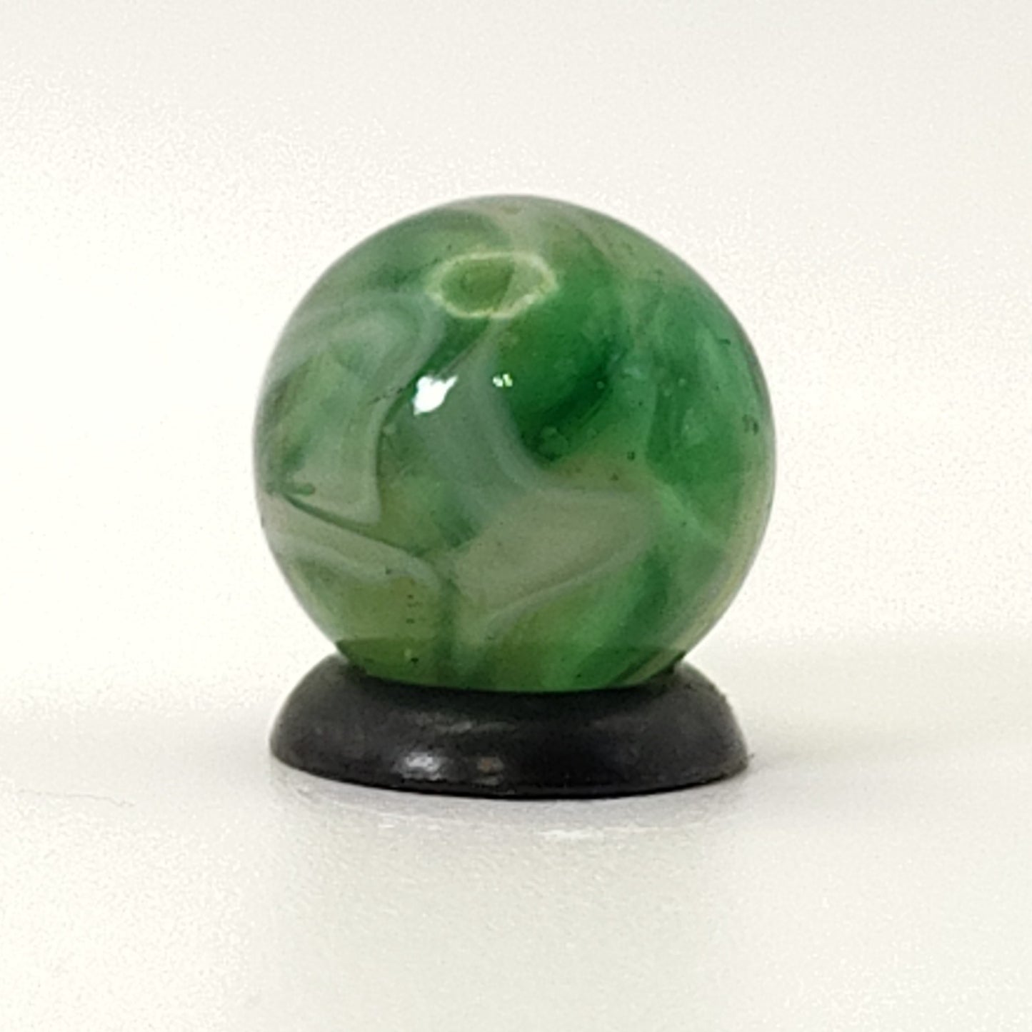 9/16" Swirl Marble green transparent base w/white & tan ribbons great backlit NM
