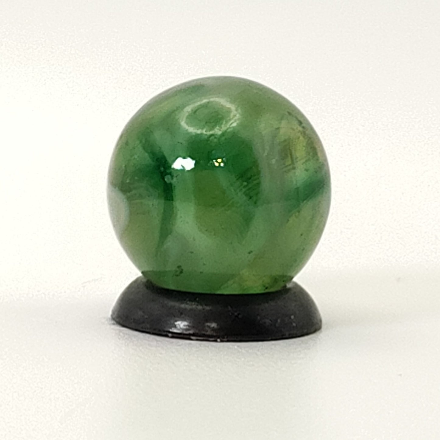 9/16" Swirl Marble green transparent base w/white & tan ribbons great backlit NM