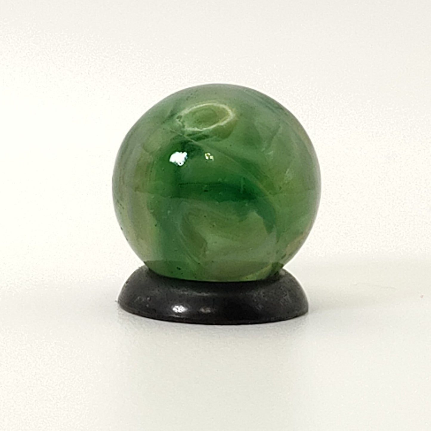9/16" Swirl Marble green transparent base w/white & tan ribbons great backlit NM