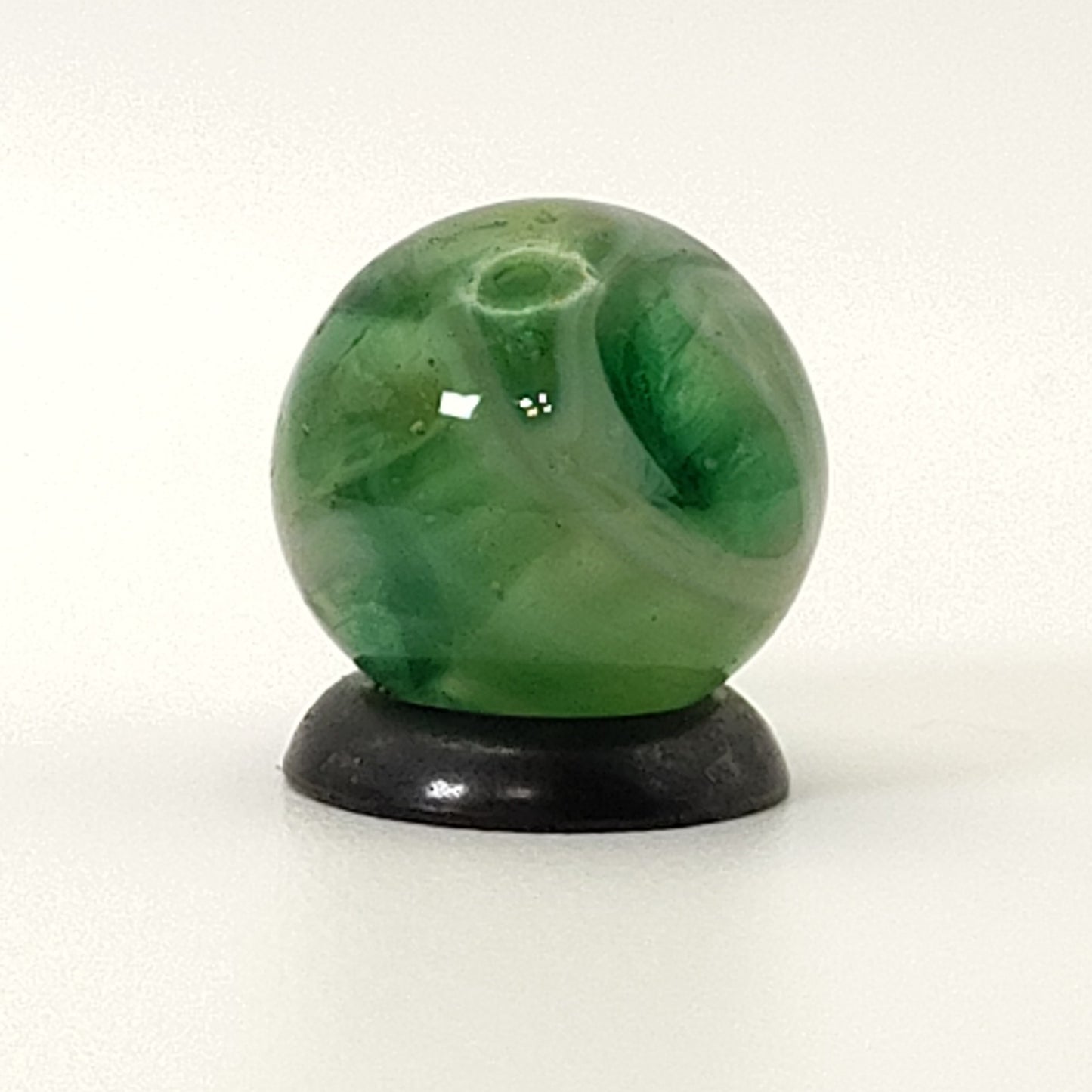 9/16" Swirl Marble green transparent base w/white & tan ribbons great backlit NM