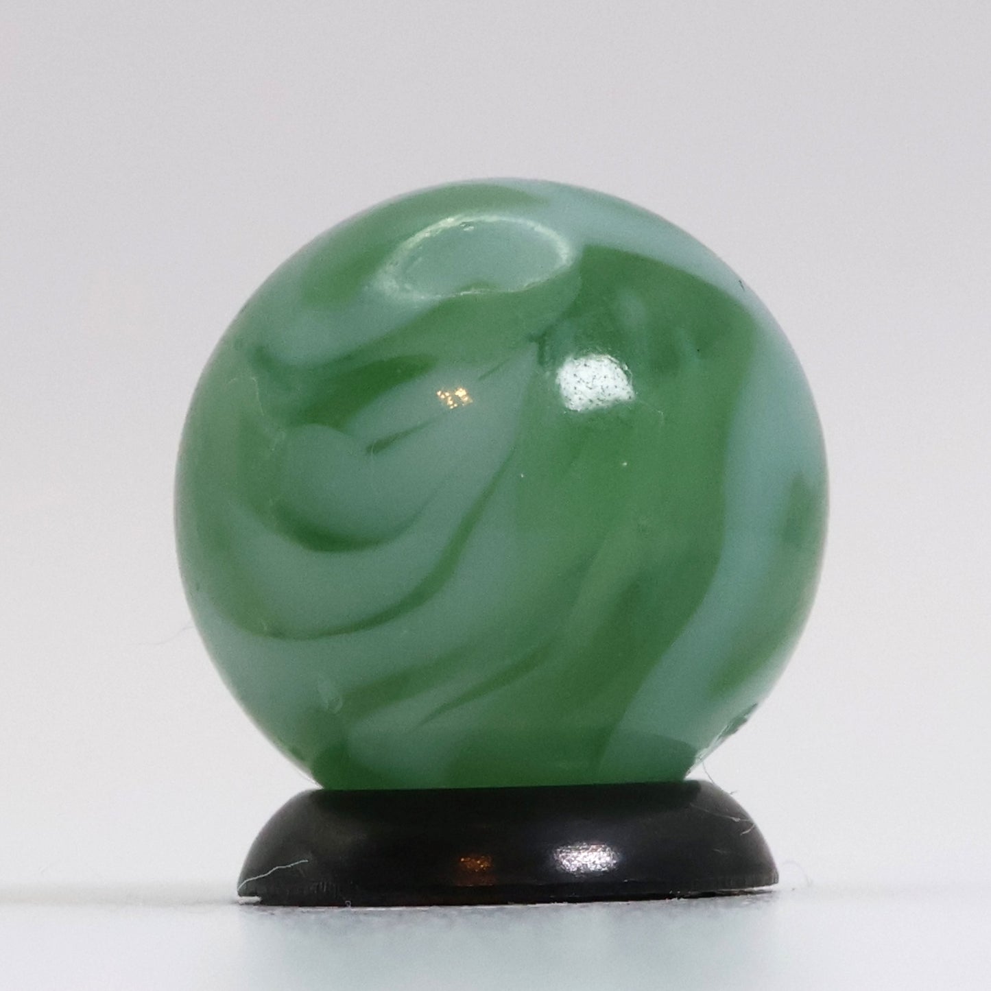 5/8" Translucent Green Marble with white ribbons busy pattern NM