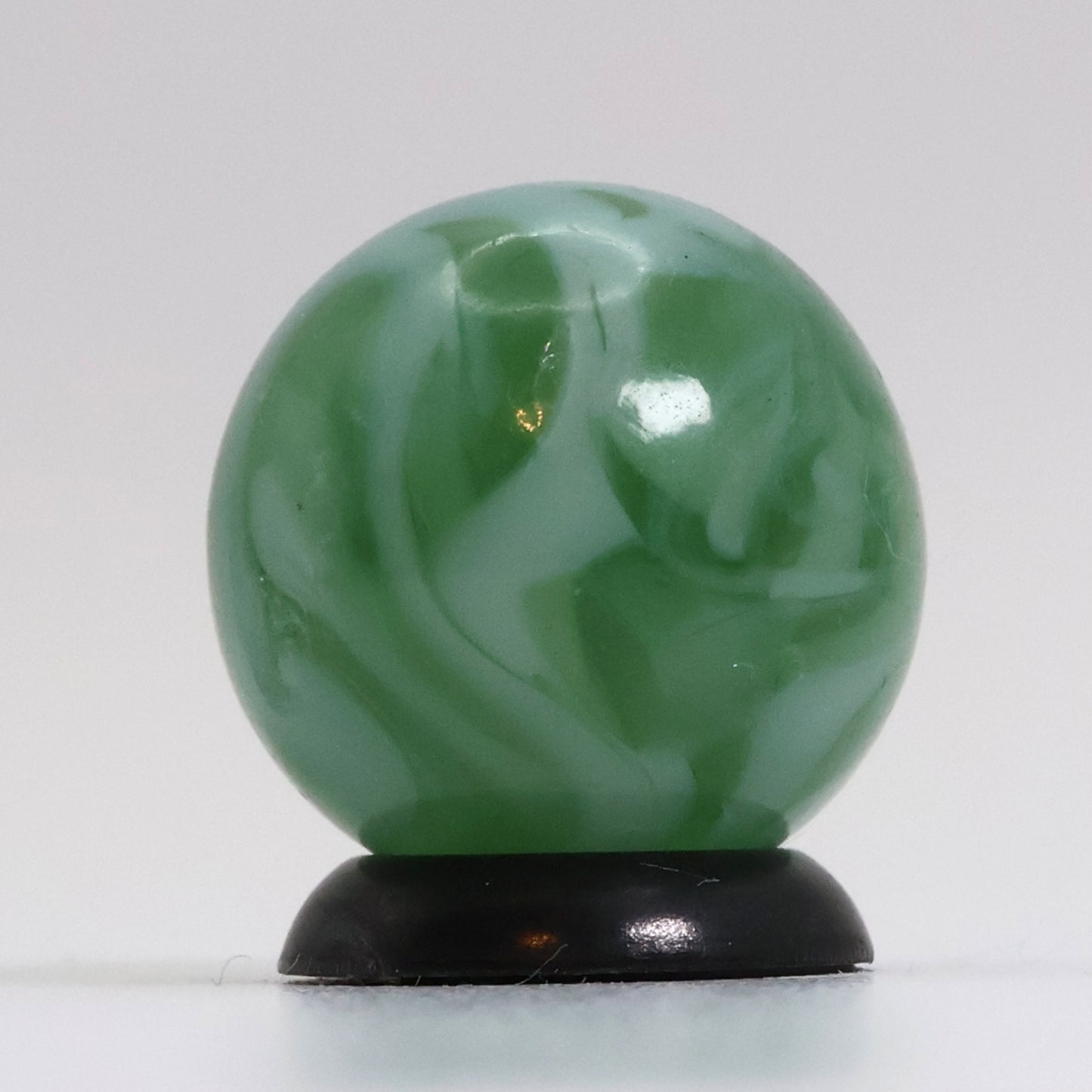 5/8" Translucent Green Marble with white ribbons busy pattern NM