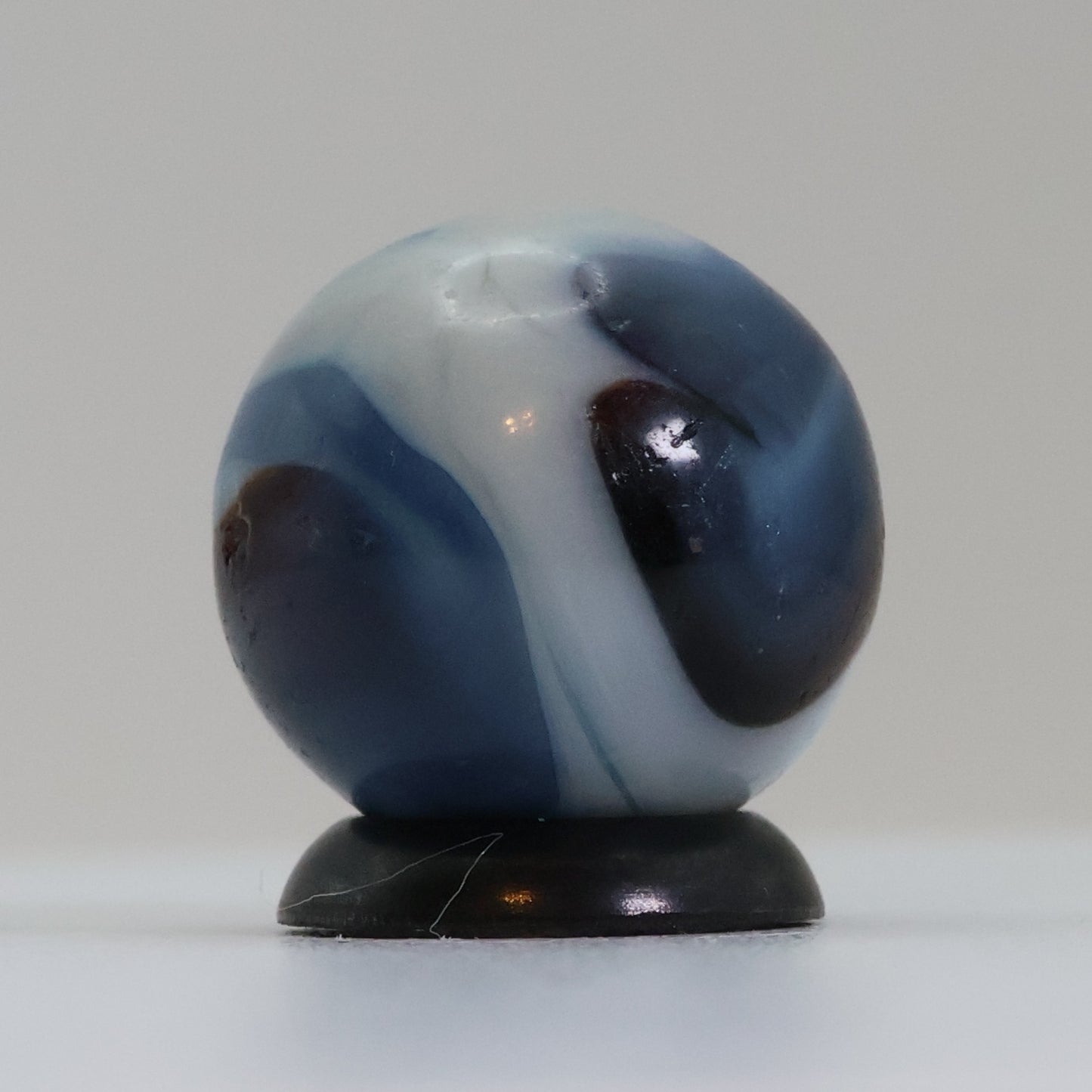 5/8" Swirl Marble Translucent Red base with blue & white Ribbons UV NM-