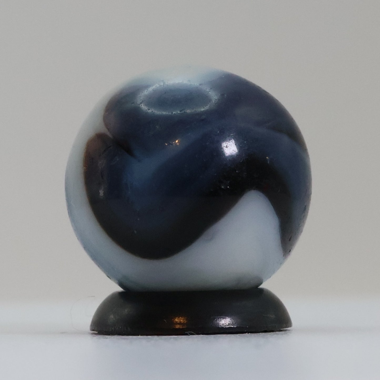 5/8" Swirl Marble Translucent Red base with blue & white Ribbons UV NM-