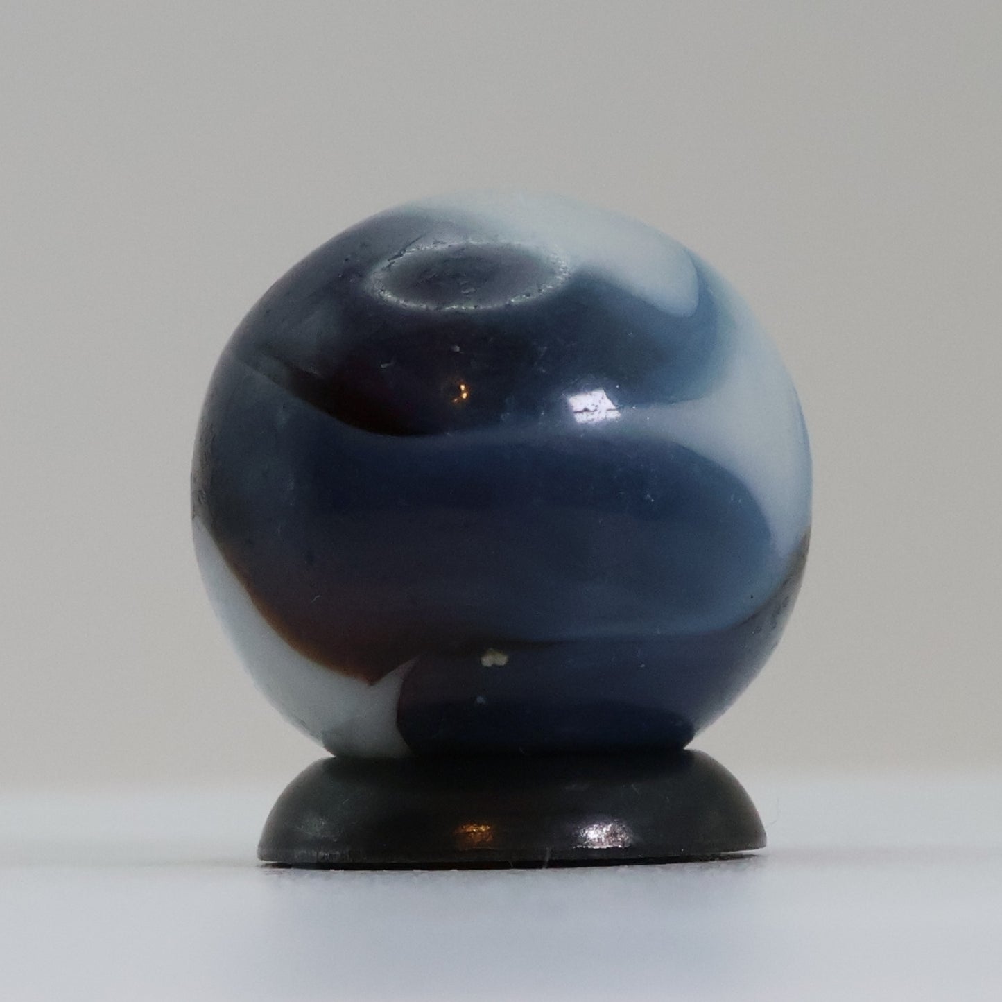 5/8" Swirl Marble Translucent Red base with blue & white Ribbons UV NM-