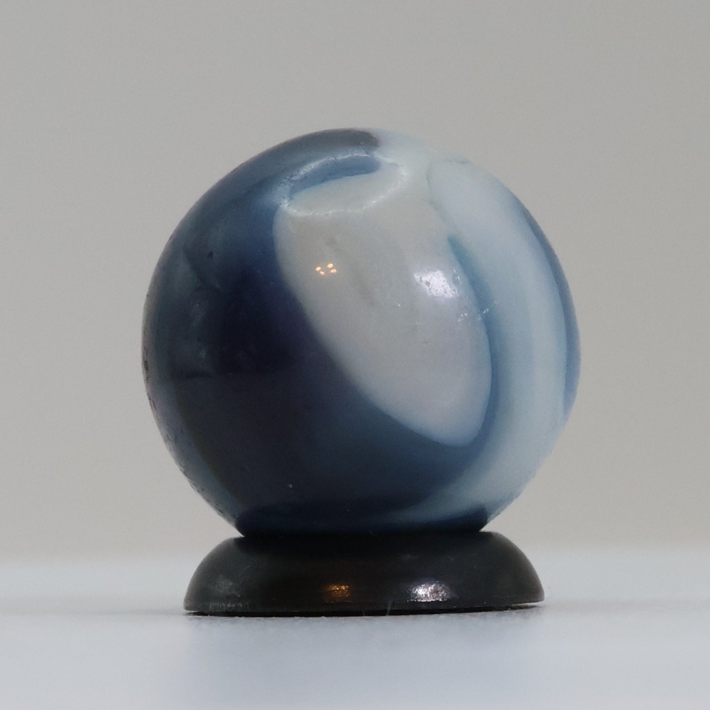 5/8" Swirl Marble Translucent Red base with blue & white Ribbons UV NM-