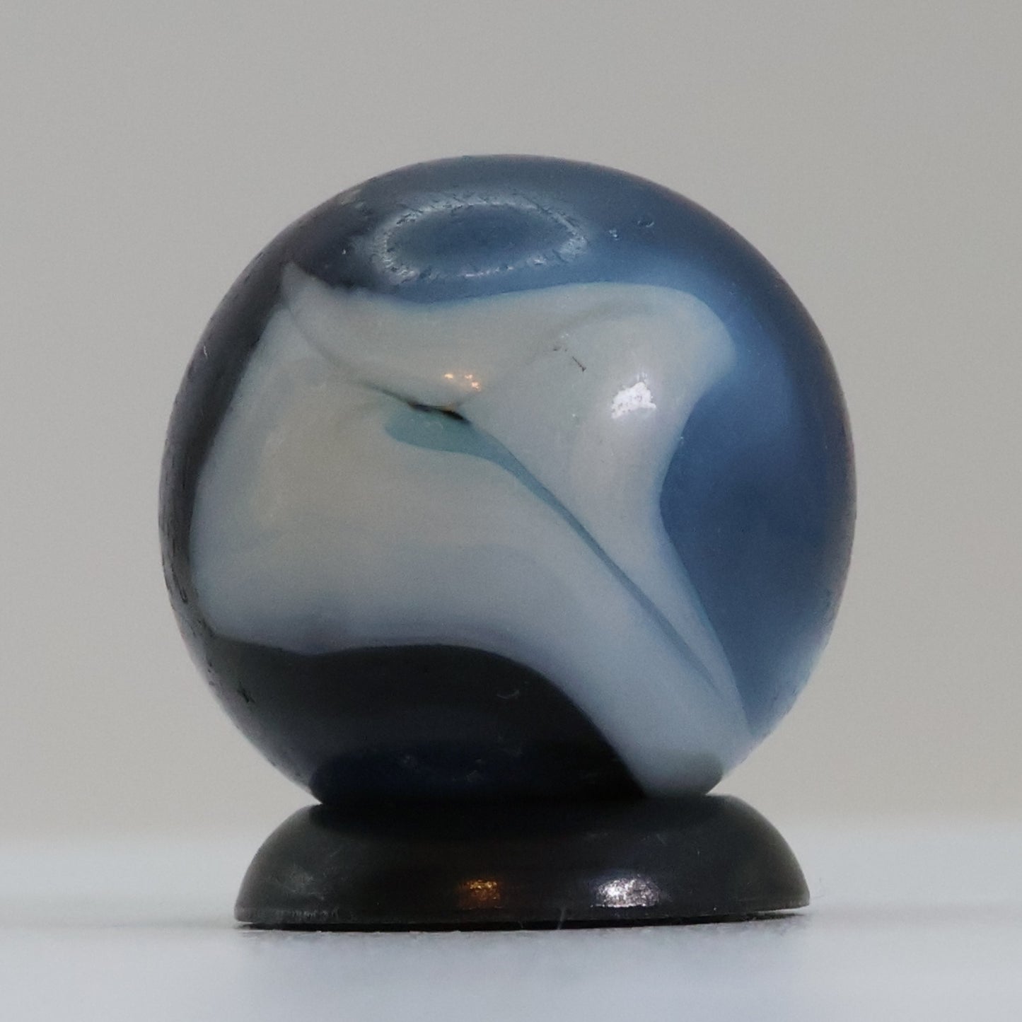 5/8" Swirl Marble Translucent Red base with blue & white Ribbons UV NM-
