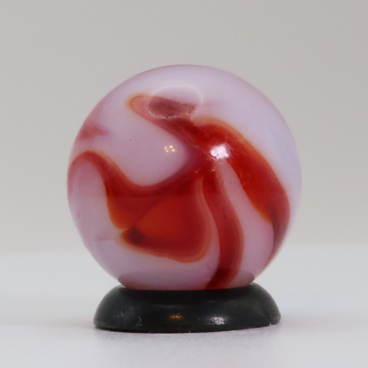5/8" Swirl marble translucent base w/ red & White ribbons NM+