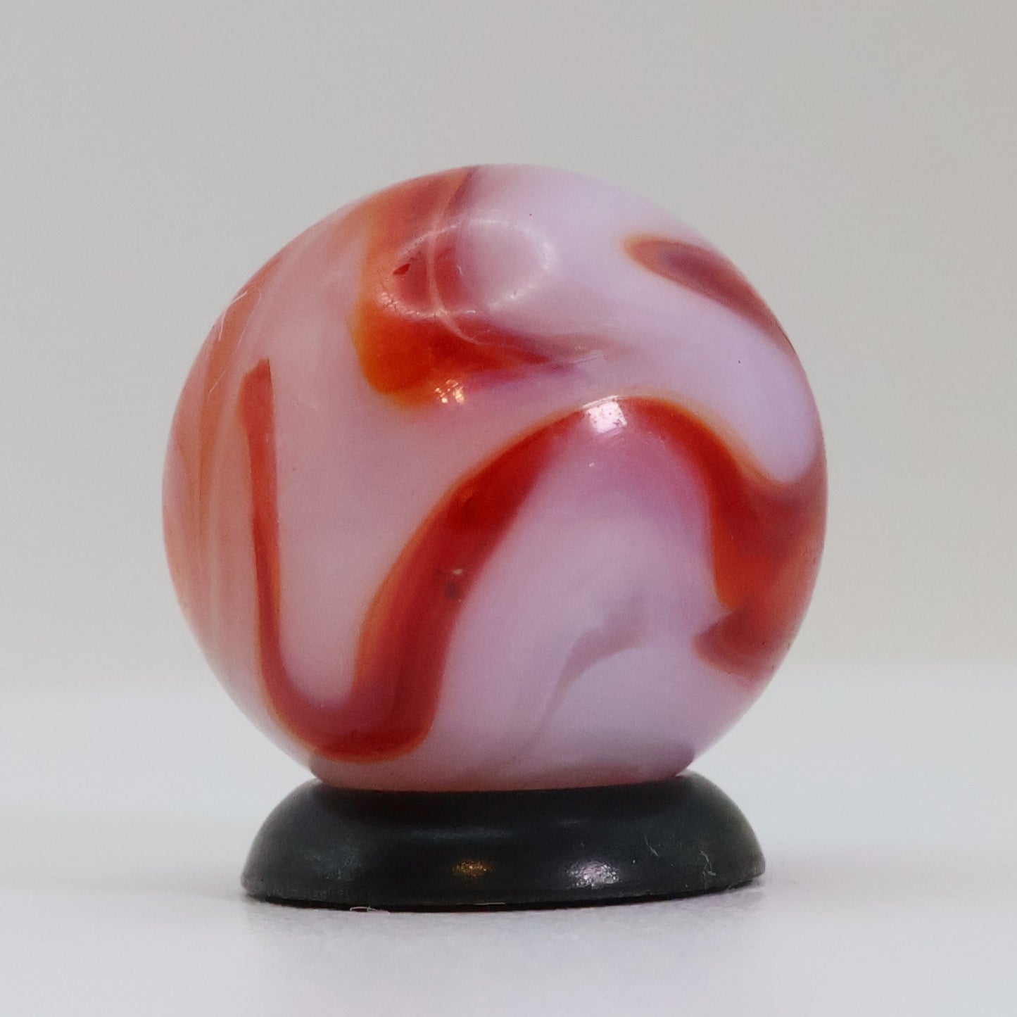 5/8" Swirl marble translucent base w/ red & White ribbons NM+