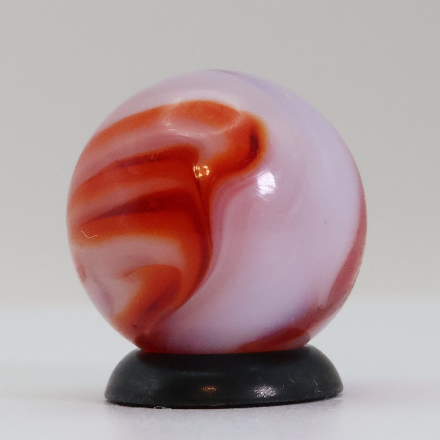5/8" Swirl marble translucent base w/ red & White ribbons NM+