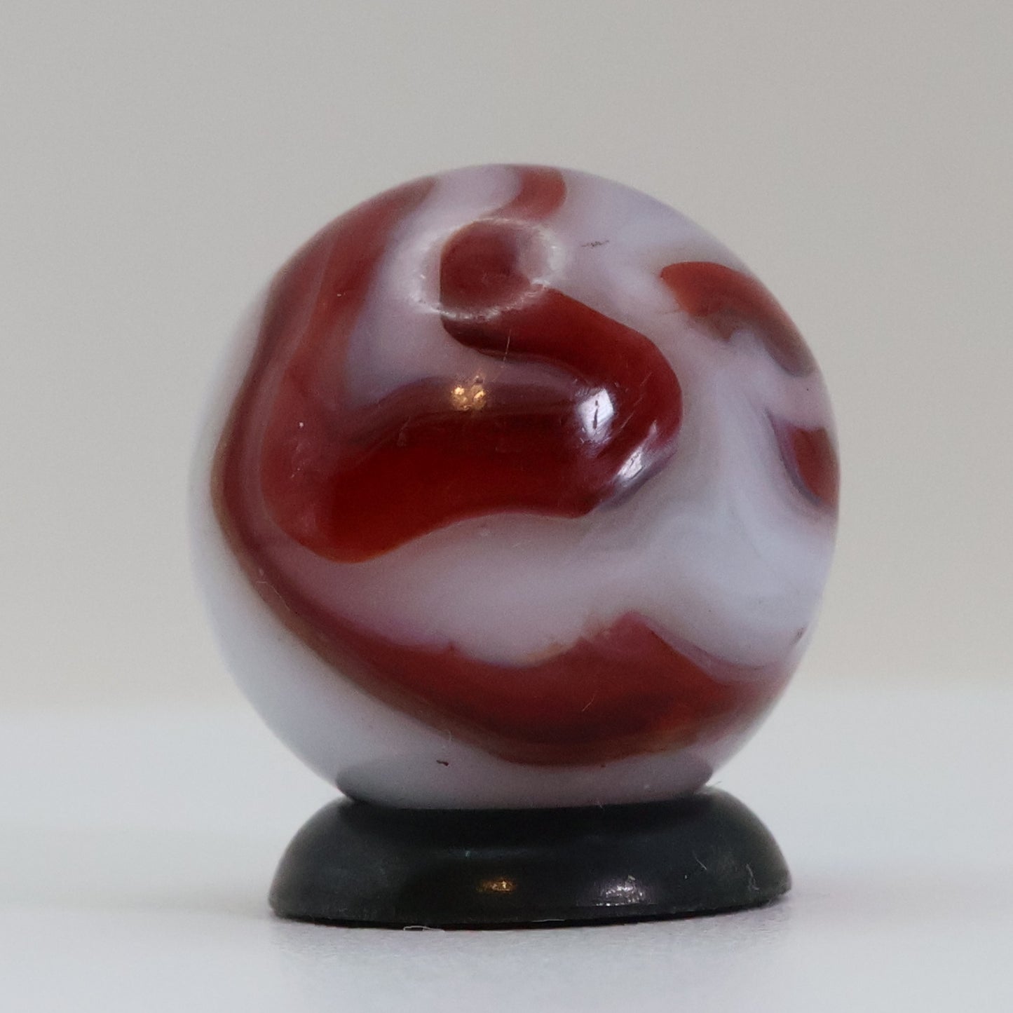 5/8" Swirl Marble Red Calligraphy on White Base NM