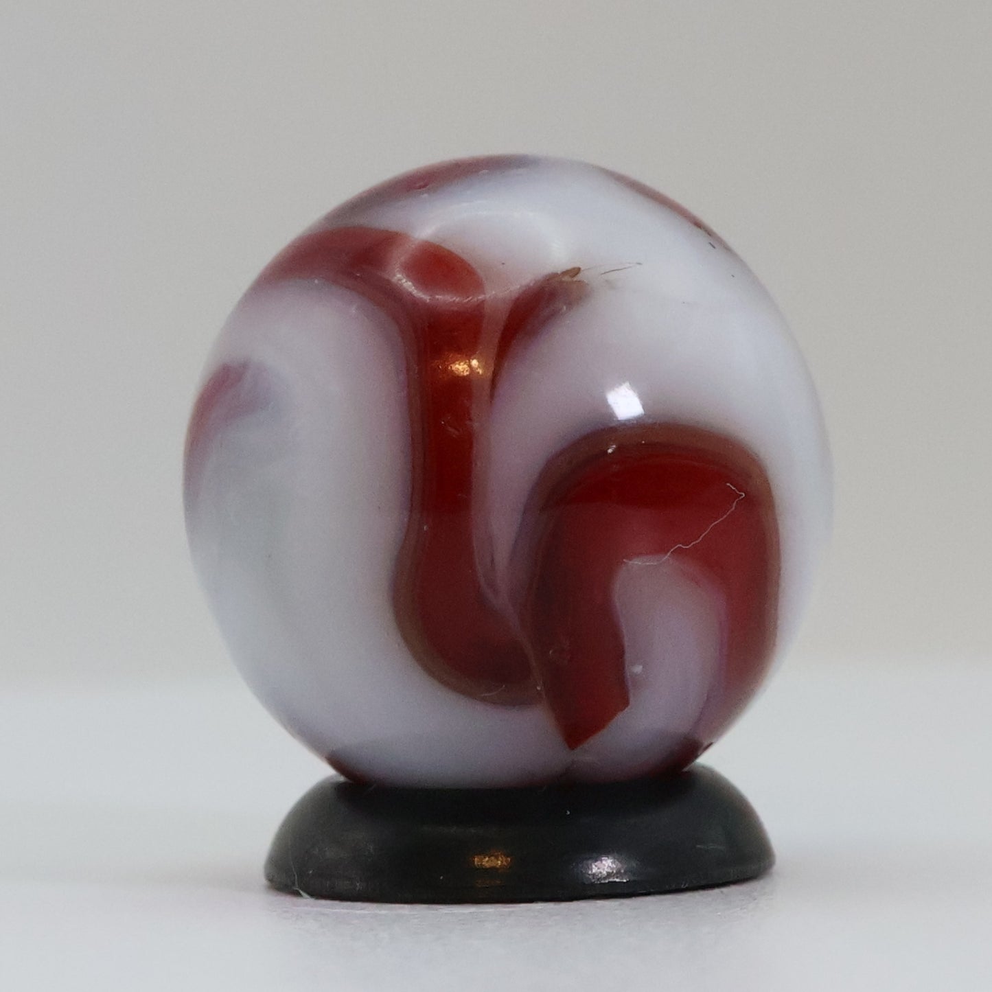 5/8" Swirl Marble Red Calligraphy on White Base NM