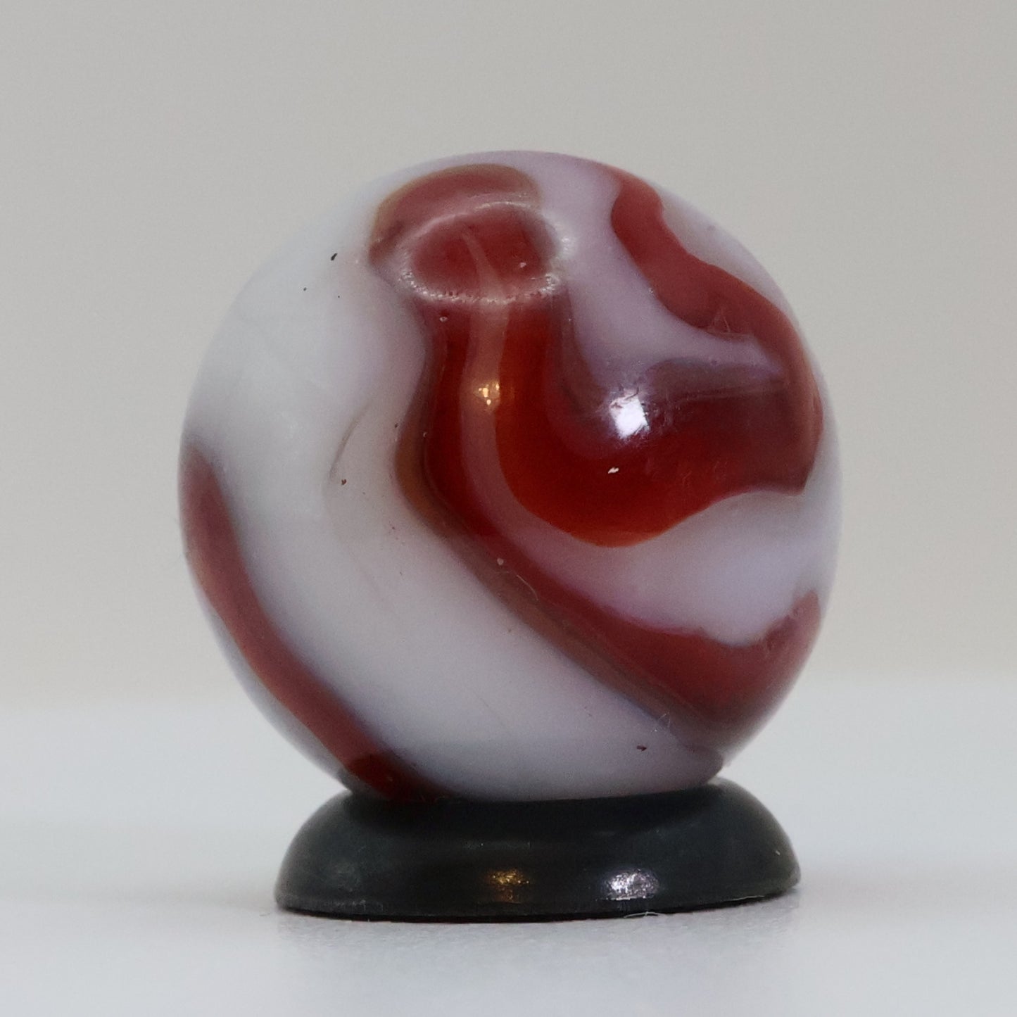 5/8" Swirl Marble Red Calligraphy on White Base NM