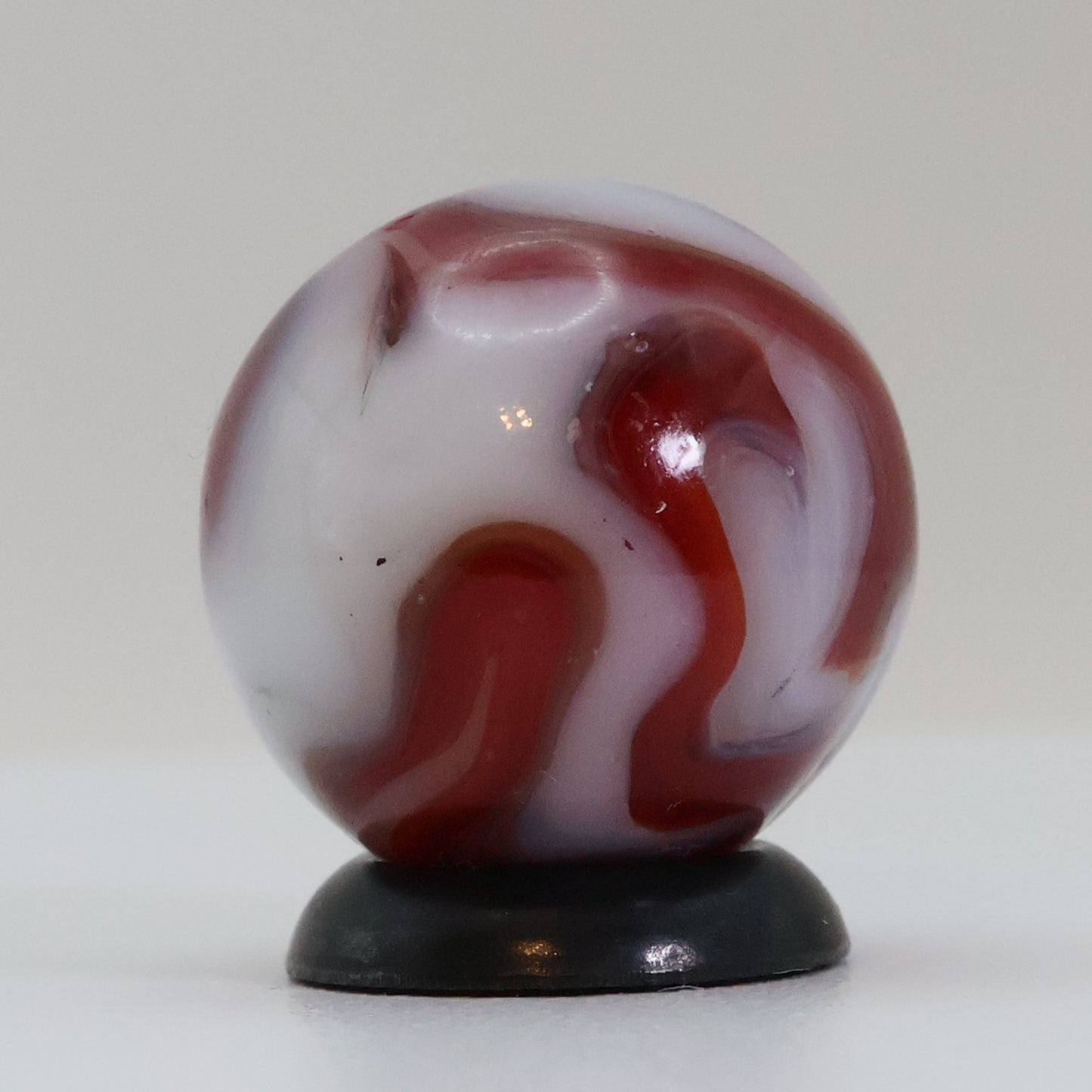 5/8" Swirl Marble Red Calligraphy on White Base NM