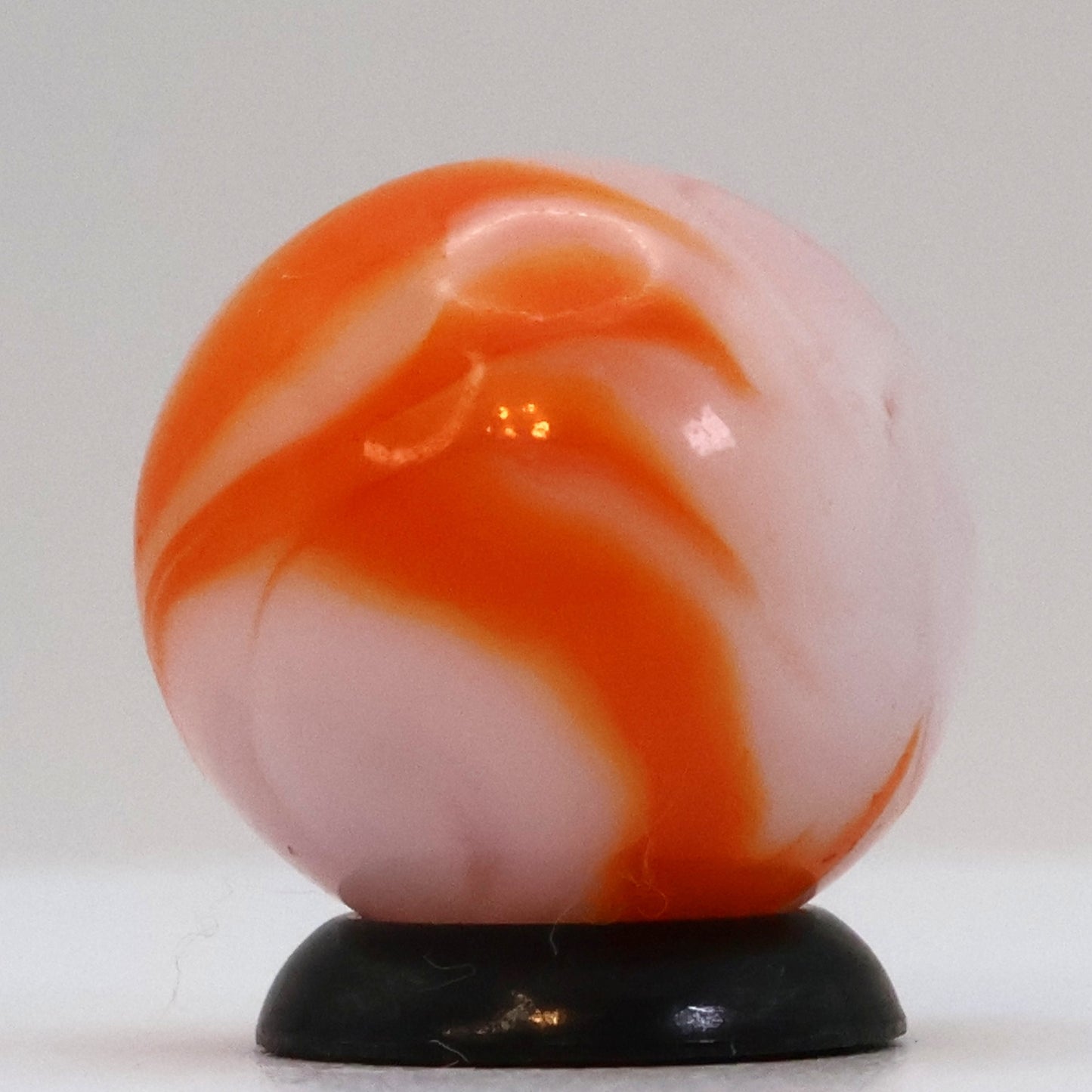 5/8" Swirl Marble orange & white, translucent base NM+