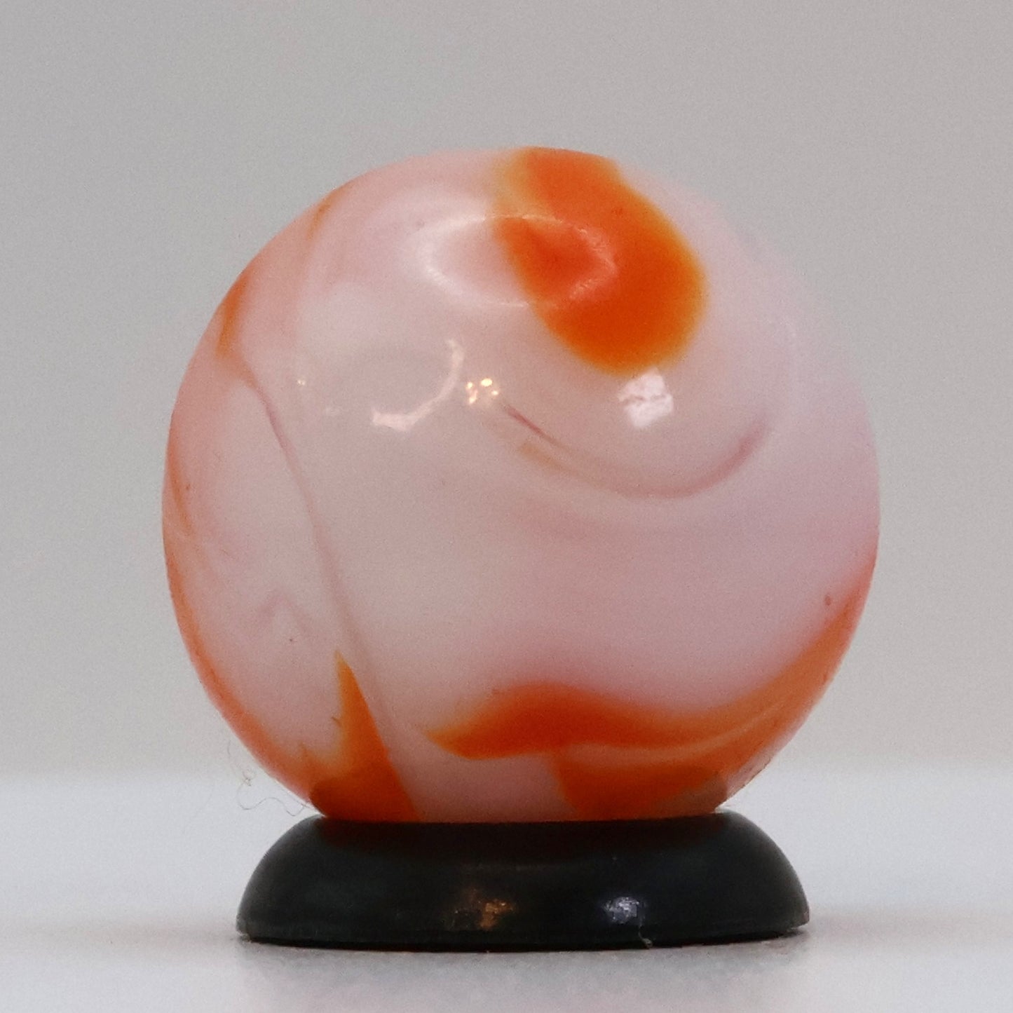 5/8" Swirl Marble orange & white, translucent base NM+