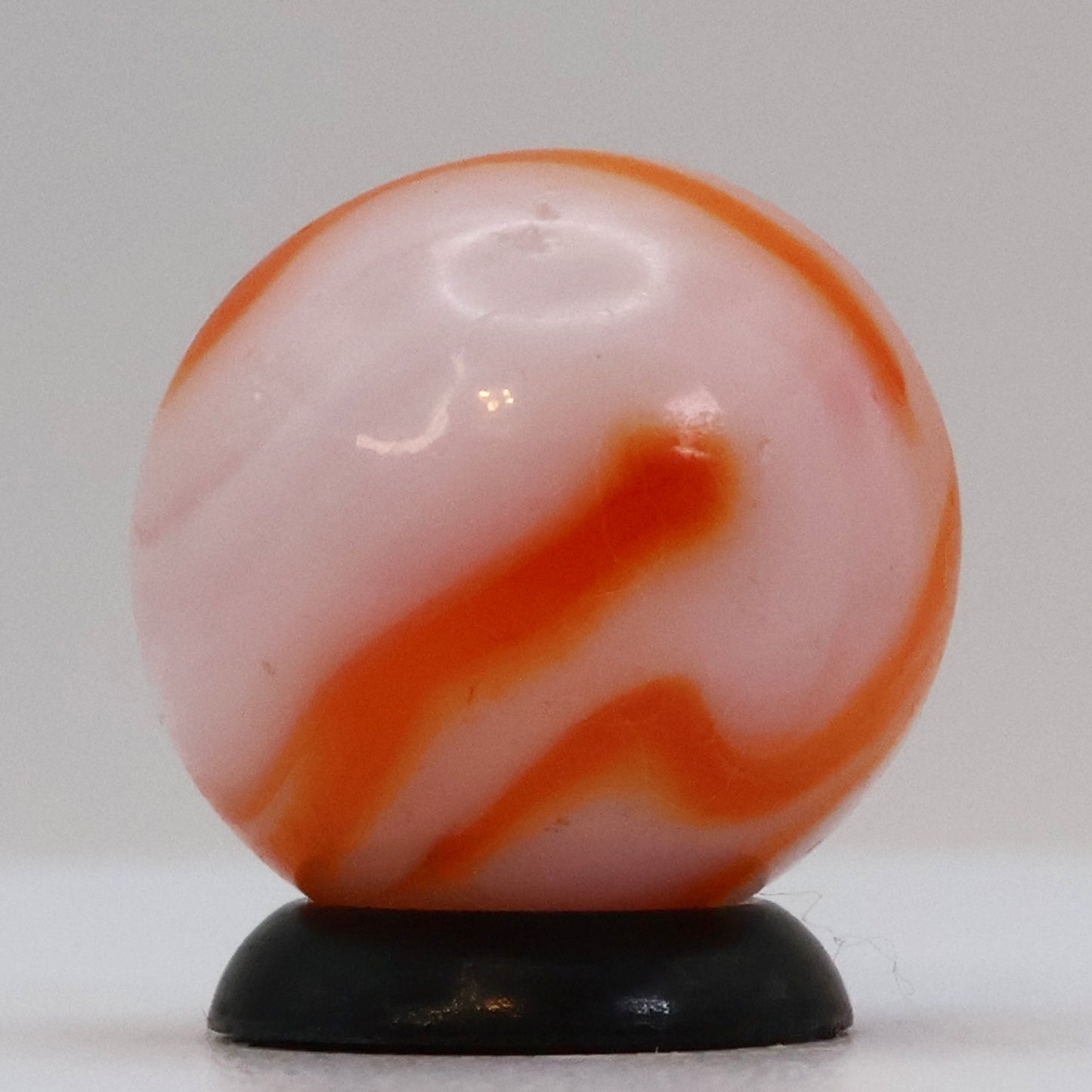 5/8" Swirl Marble orange & white, translucent base NM+