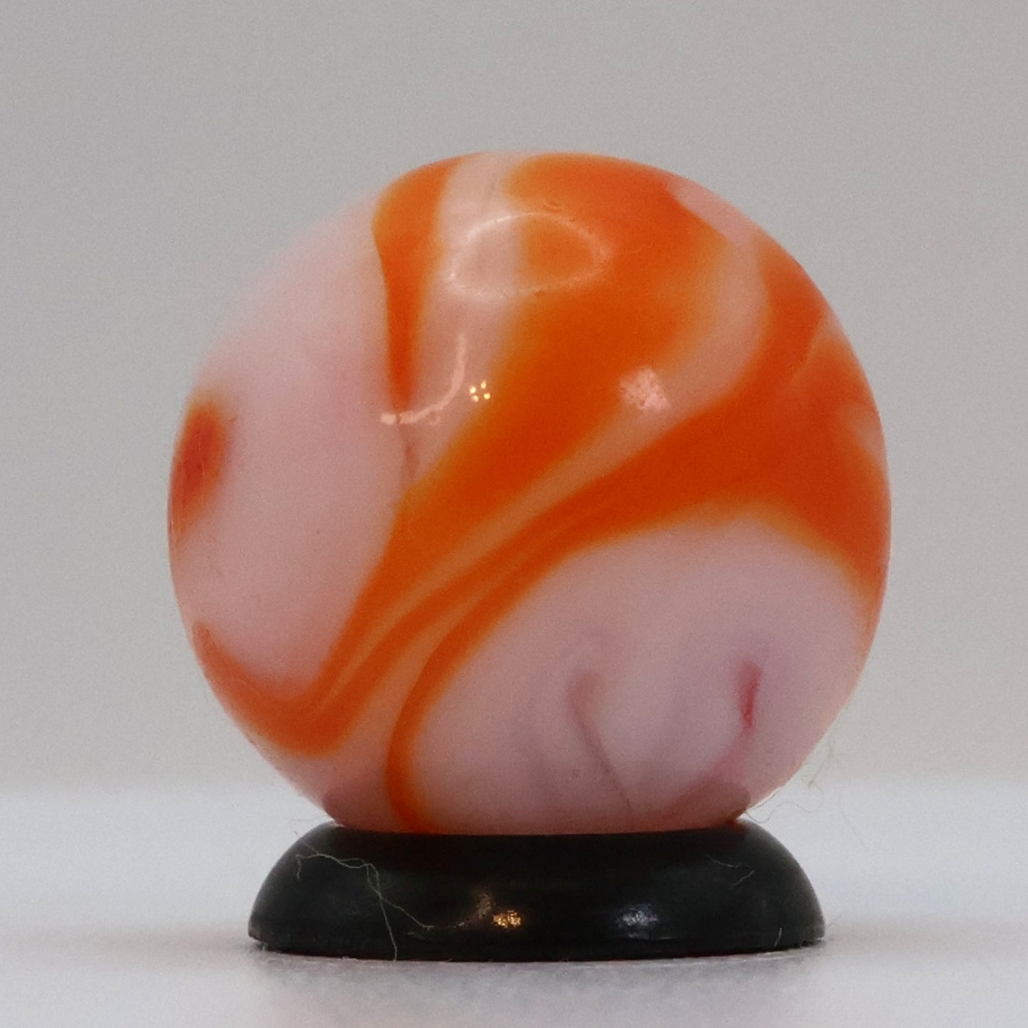 5/8" Swirl Marble orange & white, translucent base NM+