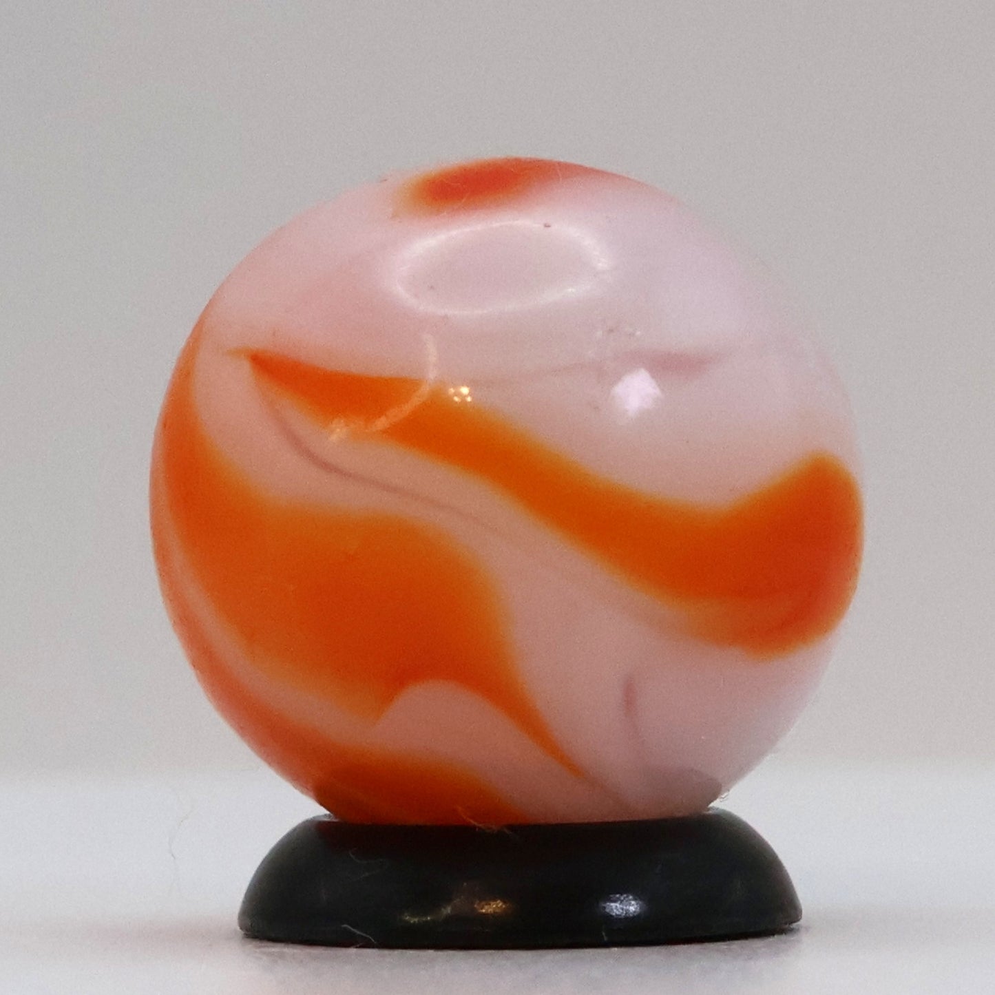 5/8" Swirl Marble orange & white, translucent base NM+
