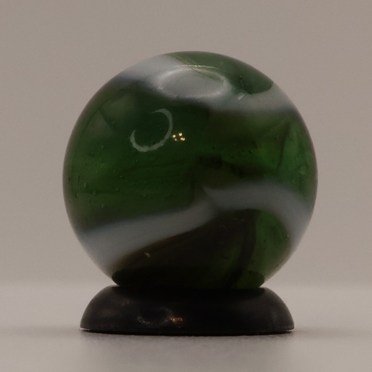 5/8" Peltier Rainbo Marble Translucent Green with white ribbons M-