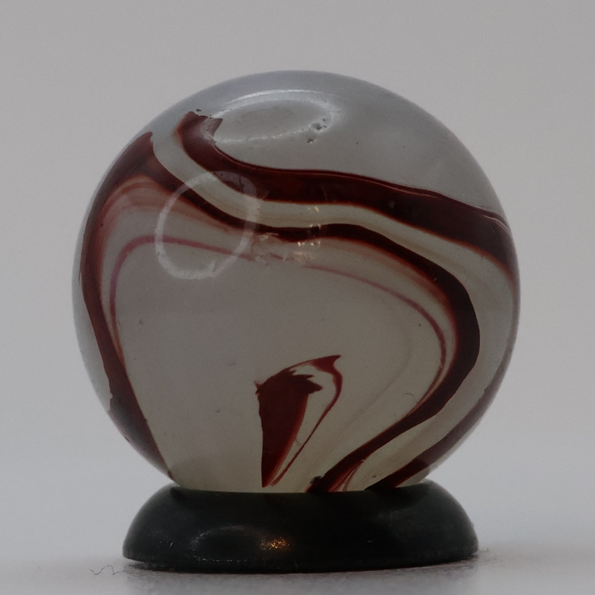 ⅝” Akro Agate Silver Oxblood NM (small pin pricks and one bigger hit)