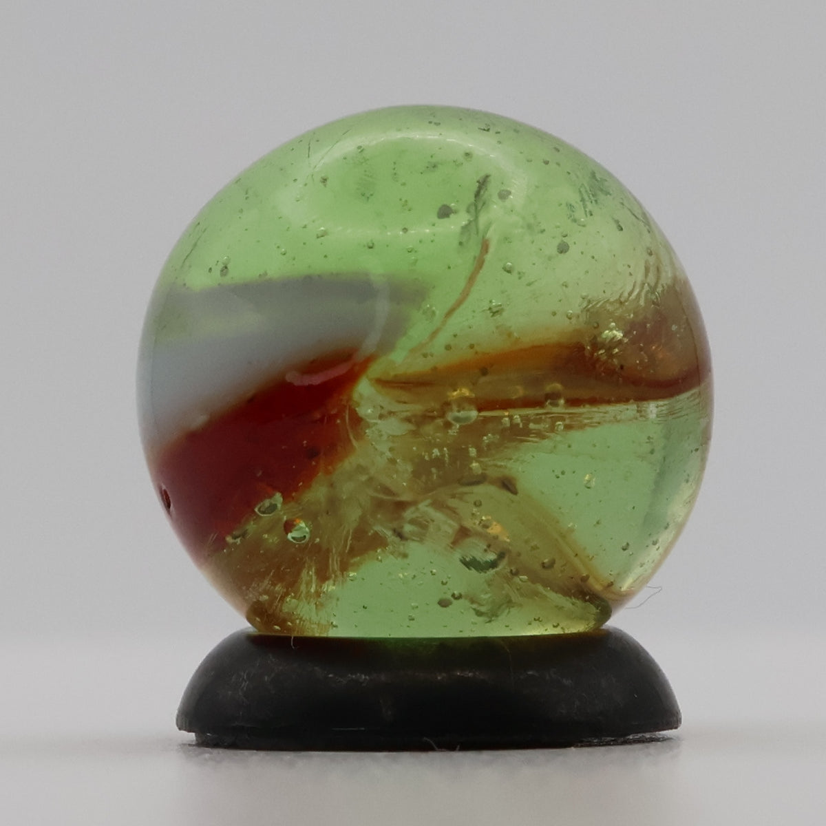 ~9/16" Peltier Rainbo Clear Based Marble - Translucent Green Base NM+