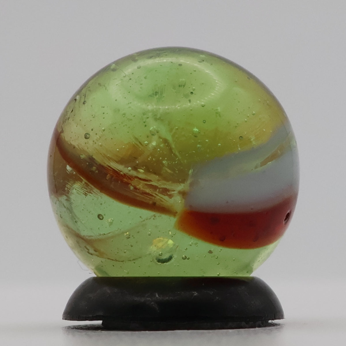 ~9/16" Peltier Rainbo Clear Based Marble - Translucent Green Base NM+
