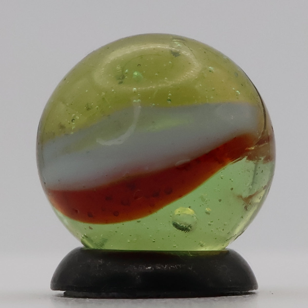 ~9/16" Peltier Rainbo Clear Based Marble - Translucent Green Base NM+