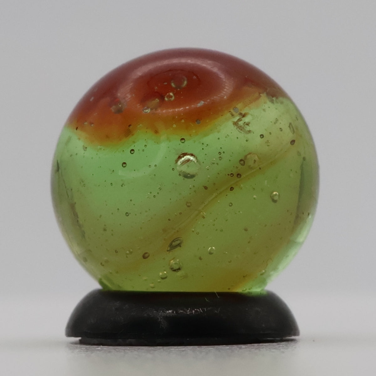 ~9/16" Peltier Rainbo Clear Based Marble - Translucent Green Base NM+