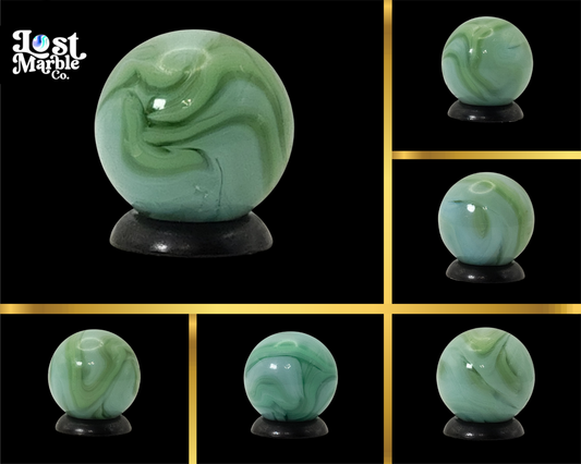 5/8" Swirl Marble Clear Base with green & blue ribbons NM