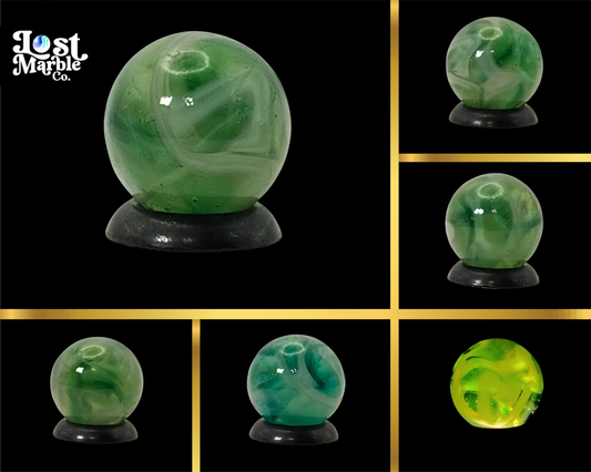 9/16" Swirl Marble green transparent base w/white & tan ribbons great backlit NM